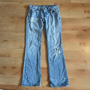 Guess ultra low rise boot cut distressed jean